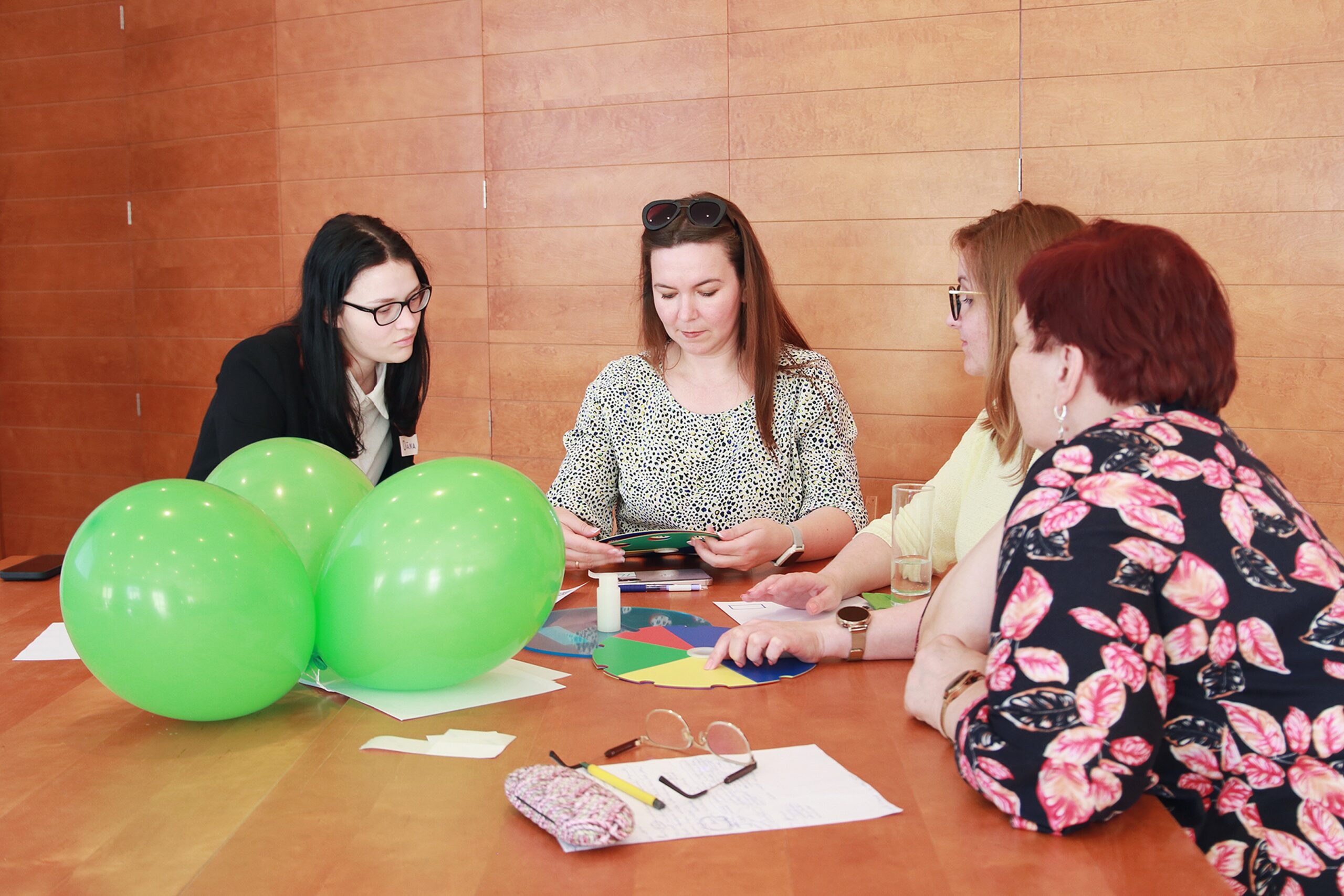 People sitting at the table in a group work
