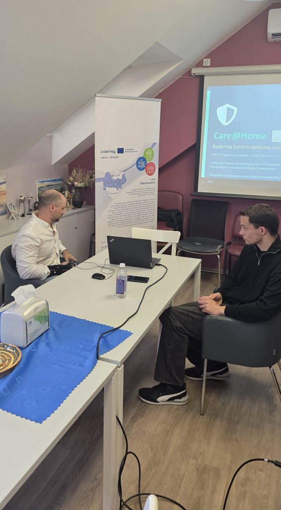 Training session for the ElderGuardian project, featuring personnel discussing integrated sensor technologies for fall prevention.