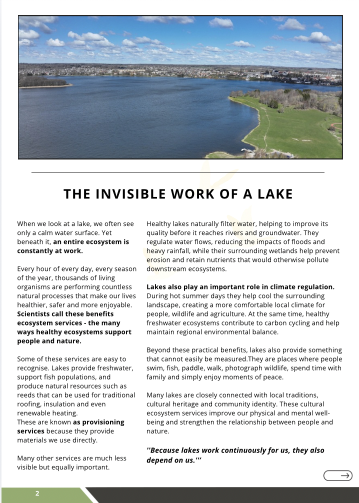 A panoramic view of a serene lake surrounded by greenery and a residential area, illustrating the essential ecosystem services provided by lakes, such as water filtration, flood regulation, and support for biodiversity, as discussed in Newsletter No. 3 of the Lakes Go Digital Project.