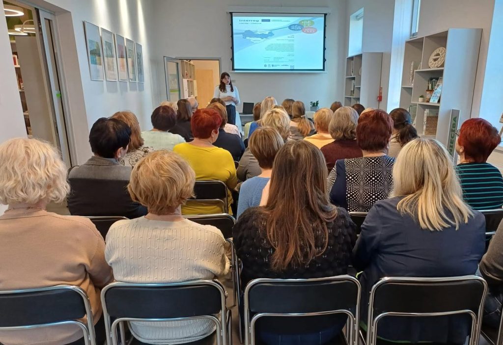 Audience participating in a presentation about the INCLUSIVE Project, showcasing results and ongoing cooperation, held in a modern meeting space with a projector screen displaying project details. Audience participating in a presentation about the INCLUSIVE Project, showcasing results and ongoing cooperation, held in a modern meeting space with a projector screen displaying project details.