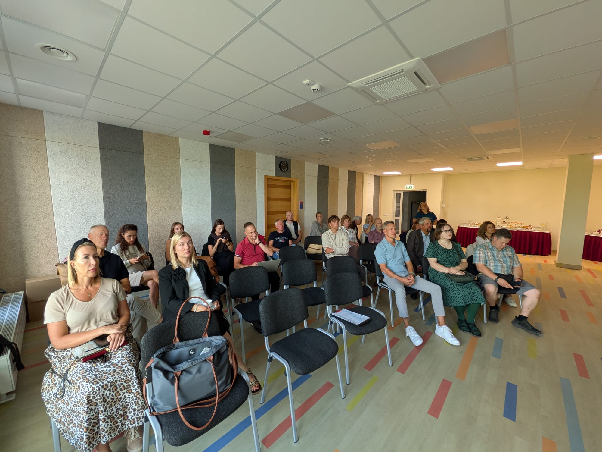Audience members attentively participate in the seminar "Water Tourism Trends in Zemgale," held in Jelgava, showcasing industry professionals engaged in discussions about water tourism developments. Audience members attentively participate in the seminar "Water Tourism Trends in Zemgale," held in Jelgava, showcasing industry professionals engaged in discussions about water tourism developments.