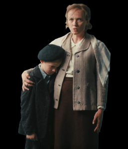 A mother and her son stand together, the mother looking concerned while the boy appears somber. They are dressed in early 20th-century clothing, symbolizing historical themes relevant to the MATOMI project, which aims to enhance museum experiences.